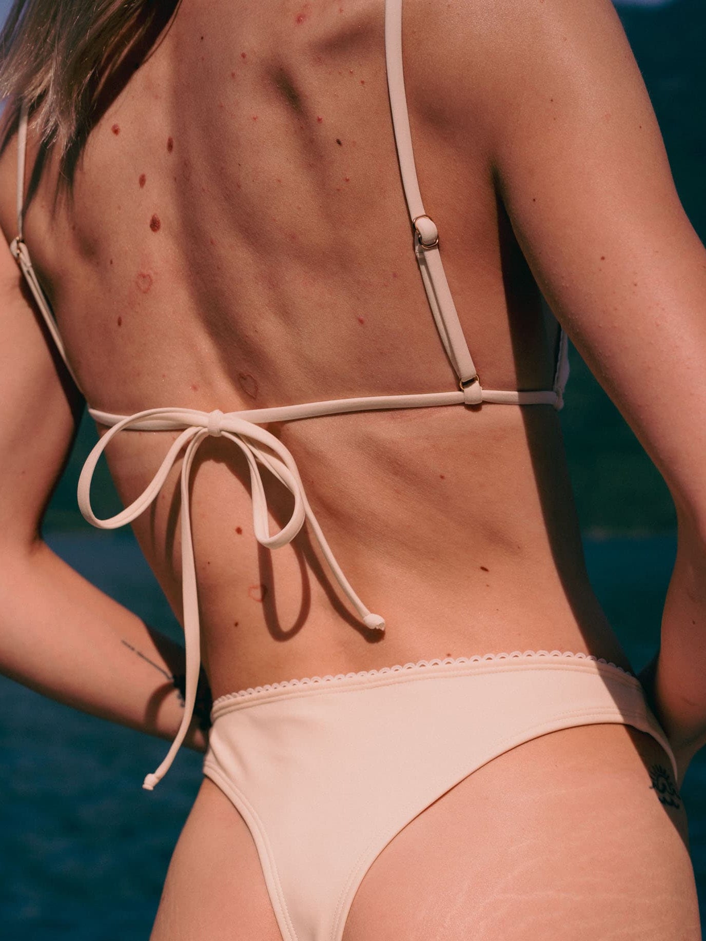 Daphne White Apricot high-cut bikini bottom by Elira Swim on model